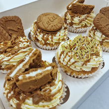 Load image into Gallery viewer, Close-up of biscoff cupcakes, featuring fluffy cupcakes topped with creamy buttercream, a drizzle of biscoff spread, and a lotus biscoff cookie garnish.&quot;
